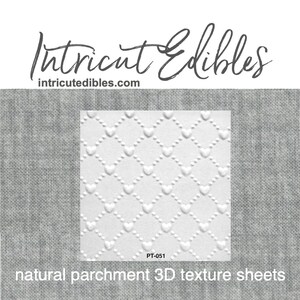 May include: White natural parchment 3D texture sheets with a repeating heart pattern. The sheets are labeled PT-051 and are displayed against a grey fabric background. The Intricut Edibles logo and website address are at the top.