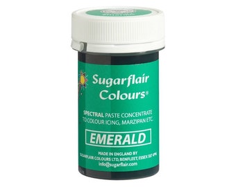 May include: A small, cylindrical container of Sugarflair Emerald food coloring. The label is green with white text, including "Sugarflair Colours" and "Emerald." The lid is white. The product is a spectral paste concentrate for coloring icing and marzipan.