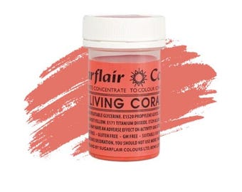 May include: A small, round, white plastic jar with a red lid. The jar contains a bright coral-colored food coloring. The label on the jar reads "Sugarflair Colors Ltd.  Living Coral Food Colour Concentrate to Colour Icing, Cakes, Fondant, Gumpaste, Buttercream, Royal Icing, Macarons, Candy Melts, Chocolate, and More."