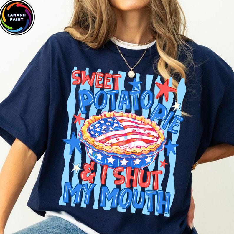 May include: Navy blue t-shirt with a graphic of a sweet potato pie decorated with an American flag design. The text reads "Sweet Potato Pie & I Shut My Mouth" in red and blue.