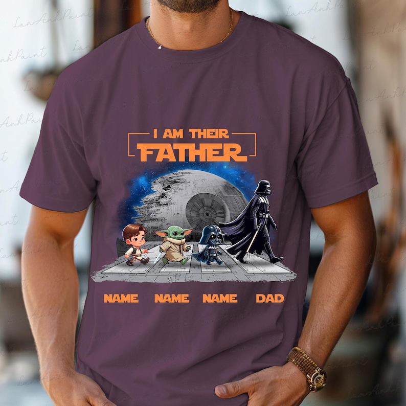 May include: Purple t-shirt featuring a Star Wars design with the text "I AM THEIR FATHER." The graphic includes cartoon characters and the Death Star. Below the characters are the words "NAME NAME NAME DAD."