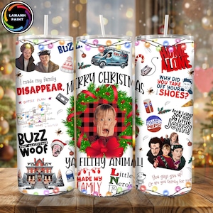 May include: A set of three white stainless steel tumblers with Home Alone-themed designs. Each tumbler features quotes, characters, and imagery from the movie, including the phrase "Merry Christmas" and the words "Ya Filthy Animal!"