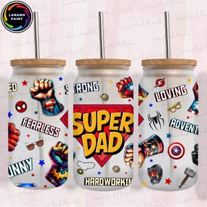 May include: Three glass tumblers with wooden lids and metal straws. Each tumbler features a "Super Dad" design with superhero-themed graphics and the words "Strong," "Fearless," and "Loving." The tumblers are decorated with various superhero logos and phrases.