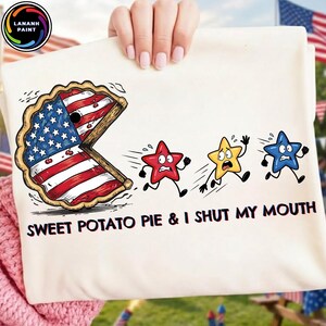 May include: A white t-shirt featuring a graphic of a pie with an American flag pattern chasing three running stars in red, yellow, and blue. The text below the graphic reads, "SWEET POTATO PIE & I SHUT MY MOUTH" in bold black capital letters.