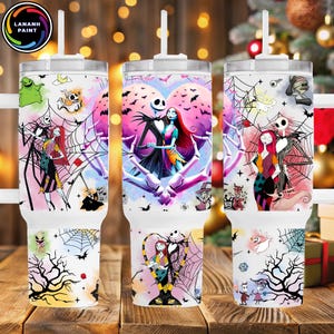 May include: Three white insulated tumblers with lids and straws. Each tumbler features a colorful design with characters from "The Nightmare Before Christmas", including Jack Skellington and Sally, with spiderwebs and bats.