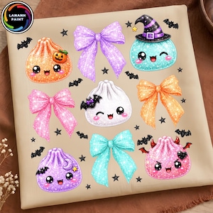 May include: A beige fabric featuring a repeating pattern of glittery, cartoon-style dumplings with faces, colorful bows, and small black bats and stars. The dumplings include an orange one with a pumpkin, a white one with a bat, and a pink devil-themed one.