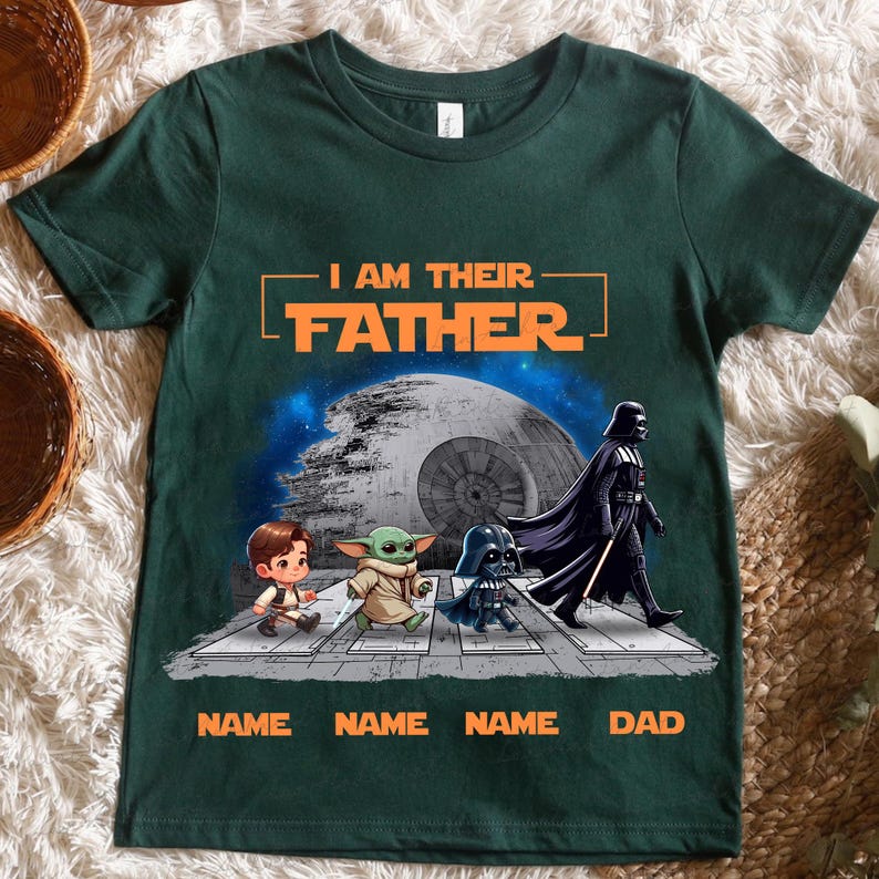 May include: Dark green t-shirt with the text "I AM THEIR FATHER" in orange. The shirt features a graphic of Star Wars characters crossing a street, with the text "NAME NAME NAME DAD" below.