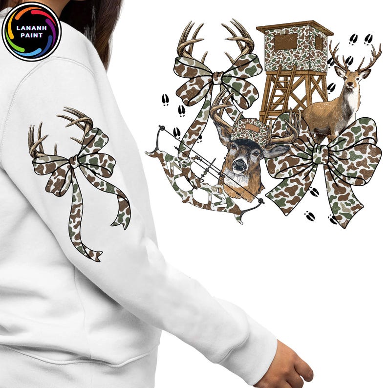 May include: White sweatshirt with a deer-themed design. The design includes a deer head, bow and arrow, camouflage bows, a deer stand, and a deer. The design is in shades of brown, green, and white.