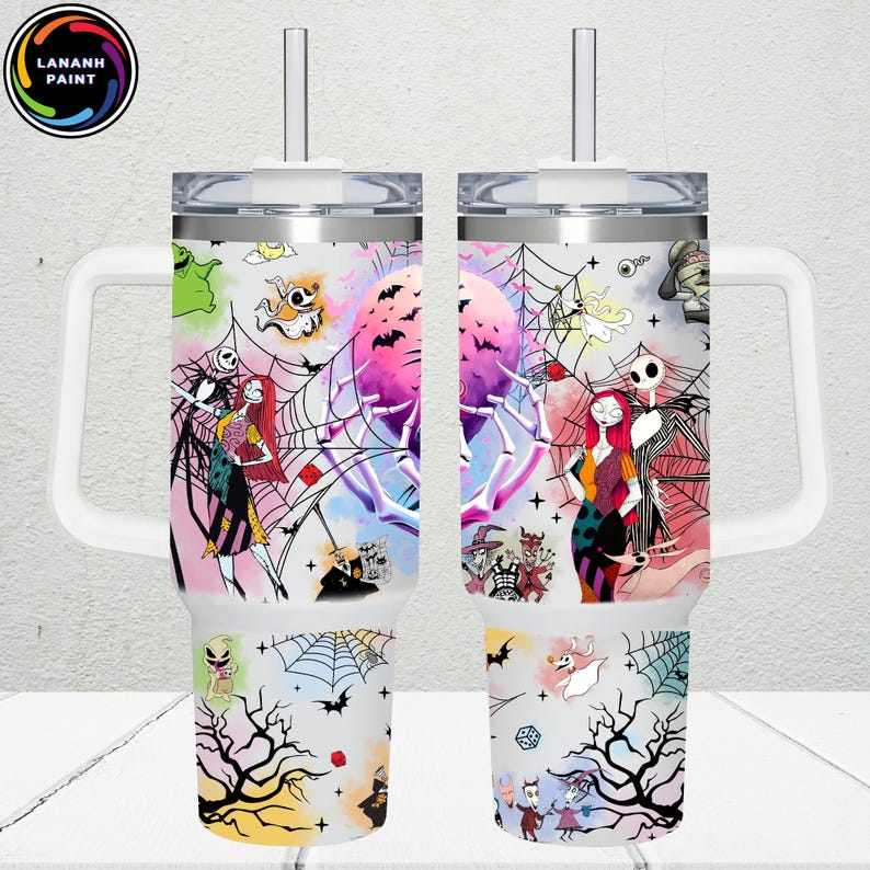 May include: Two white handled tumblers with a colorful design featuring characters and elements from "The Nightmare Before Christmas." The design includes Jack Skellington, Sally, spiderwebs, bats, and the text "LANANH PAINT."