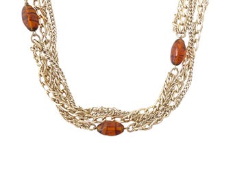 Collar largo y llamativo de estilo retro bohemio, estilo vintage de los años 70, de Emmons, con cadena de aluminio chapada en oro claro y cuentas de vidrio a rayas color ámbar.