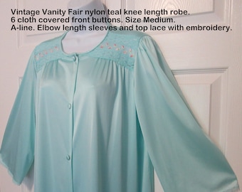 44 bust Vanity Fair robe, 6 cloth covered front buttons, Nylon teal knee length, A-line, Elbow length sleeves, Top lace embroidery