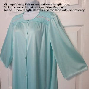 44 bust Vanity Fair robe, 6 cloth covered front buttons, Nylon teal knee length, A-line, Elbow length sleeves, Top lace embroidery