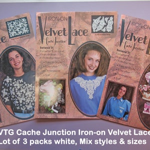 May include: Three packs of white iron-on velvet lace, each with a different design and size. The packaging features a model wearing each design and the text "Iron-on Velvet Lace Cache Junction Believe It!"