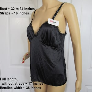 Sz S 34 inch bust never worn camisole, Black nylon, Softly shaped bra top low V neck, Adjustable straps, Paper hang tag, Shadowline Made USA
