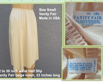 22 to 30 inch waist Half Slip, Vanity Fair beige nylon, 23 inches long, Slight A line style with narrow lace hem, Made in USA, VTG