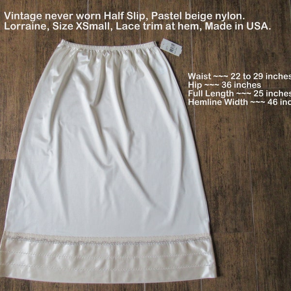 Sz XS nylon half slip w/paper tag, 22 - 29 elastic waist, Never worn Lorraine pastel beige, Lace trim hem, Made in USA, A line, VTG