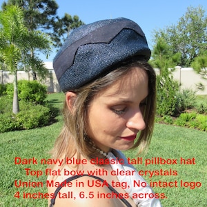 Dark navy blue pillbox hat, Top flat bow w/ clear crystals, Union Made in USA tag, No intact logo, 4 inches tall, 6.5 inches across, Classic