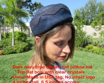 Dark navy blue pillbox hat, Top flat bow w/ clear crystals, Union Made in USA tag, No intact logo, 4 inches tall, 6.5 inches across, Classic