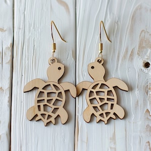 Archivo cortado con láser de aretes de madera con forma de tortuga