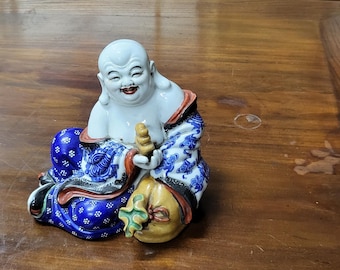 Vintage Chinese porseleinen afbeelding van de Lachende Boeddha.