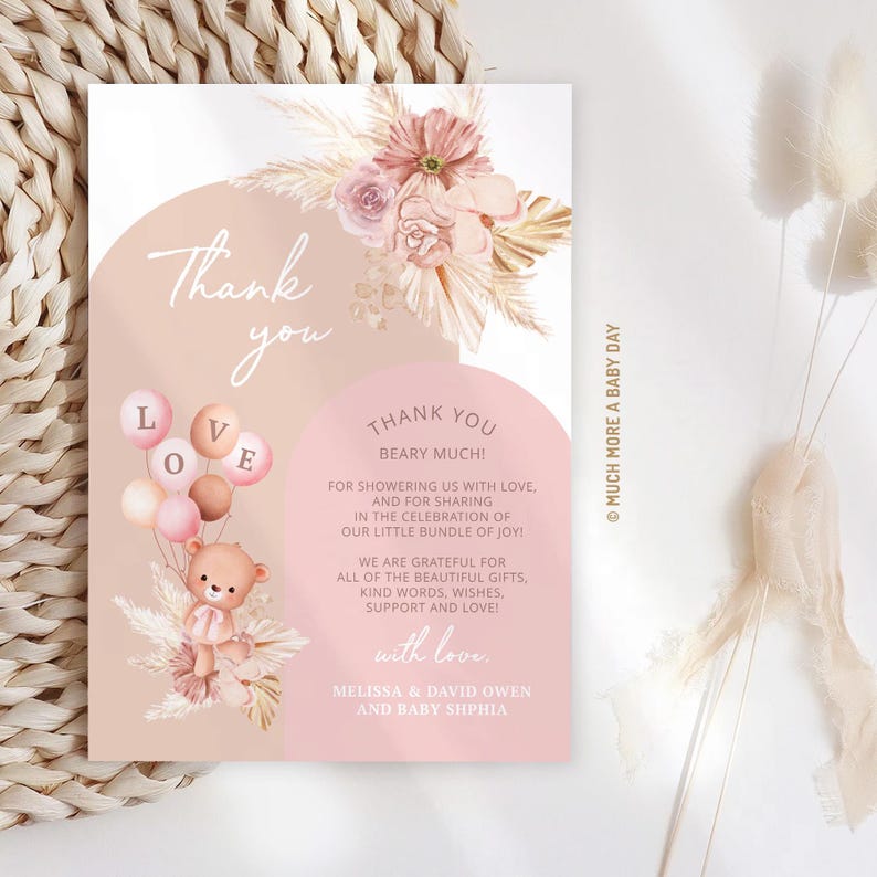 May include: Thank you card with a pink and brown color scheme. The card features a teddy bear holding balloons that say "LOVE" and a floral arrangement. The text on the card reads "Thank you beary much!" and includes a message of gratitude for gifts and support. The card is signed "Melissa & David Owen and Baby Sophia".