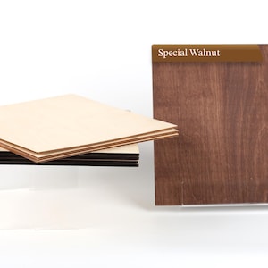 May include: A stack of three square wooden boards with light-colored surfaces and dark edges, positioned next to a single square wooden board with a dark brown finish labeled with the text Special Walnut in a brown banner at the top.