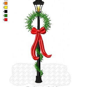 May include: A black lamp post with a green wreath and a red bow. The lamp post is decorated for Christmas and is standing on a white background.
