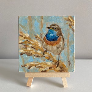 Oil painting of a bluethroat bird in the reeds