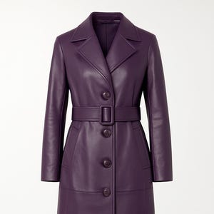 May include: A long, purple leather coat with a belted waist and button-down front. The coat features a notched collar, long sleeves, and a knee-length hemline. The coat has a classic, tailored design.