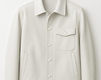 May include: A light-colored jacket with a classic collar, button-down front, and a single chest pocket. The jacket has two side pockets and is made of a smooth material. The stitching is visible around the edges.