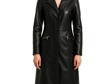 May include: A long, black leather coat with a notched collar and two zippered pockets. The coat has a tailored fit and a knee-length hemline. The sleeves are long, and the coat is buttoned down the front.