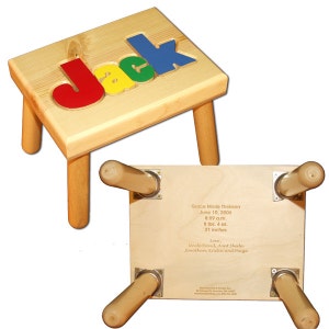May include: A wooden child's step stool with the name "Jack" spelled out in colorful letters on the top. The bottom of the stool is engraved with a birth announcement for Grace Marie Theissen, including her birth date, time, weight, and length.