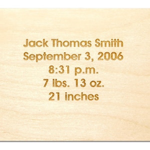 May include: A wooden plaque with the text "Jack Thomas Smith, September 3, 2006, 8:31 p.m., 7 lbs. 13 oz., 21 inches" engraved in gold.