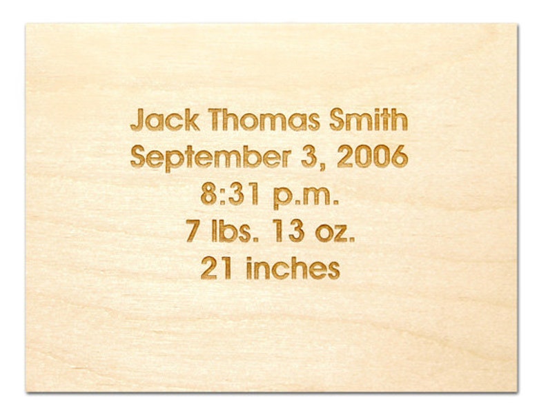May include: A wooden plaque with the text "Jack Thomas Smith, September 3, 2006, 8:31 p.m., 7 lbs. 13 oz., 21 inches" engraved in gold.