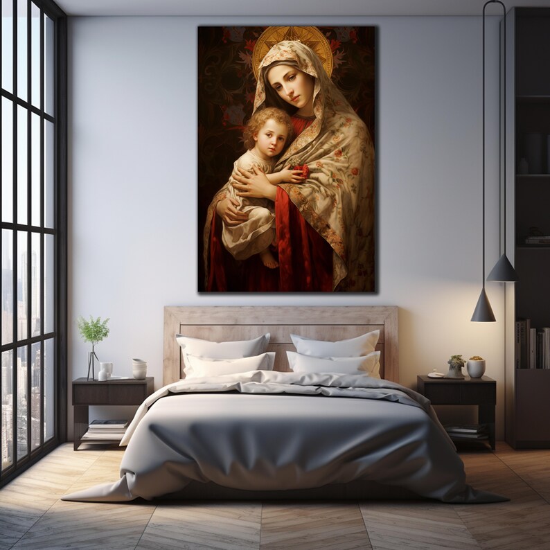 May include: A painting of the Virgin Mary holding a baby Jesus. The painting is in a traditional style with a gold halo around the Virgin Mary's head. The Virgin Mary is wearing a white and gold robe with a red sash. The baby Jesus is wearing a white robe and is holding a red apple.