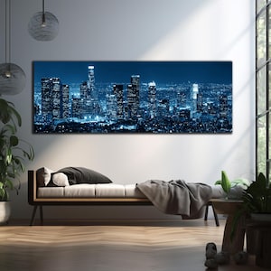 May include: A panoramic canvas print of a cityscape at night, dominated by tall skyscrapers illuminated in shades of blue and white. The artwork captures the urban landscape with a focus on architectural details and city lights.