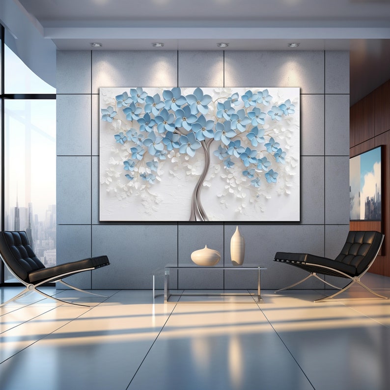 May include: A large, abstract canvas print featuring a stylized blue and white tree with a silver trunk. The tree is surrounded by a white background.