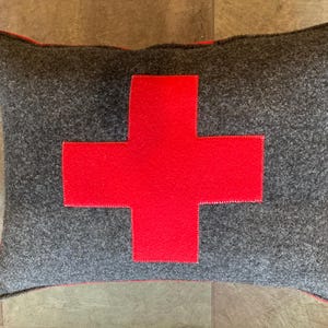 Rectangular Ski Patrol First Aid Swiss Cross Army accent pillow about 12”x 16” gray felt and  red with canvas back