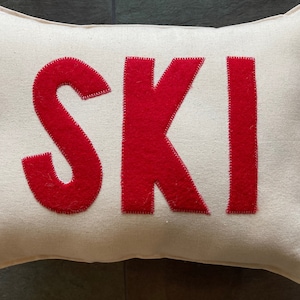 Ski chalet alpine pillow about 12"X 16" with red felt and natural fabric skiing