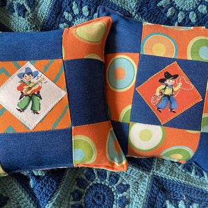 Choice of little cowboy lasso or guitar Western accent pillow about 10 &quot; X 11&quot; with orange and denim