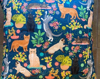 Kitty cats pillow with montera plants in teal about 16"x16" kitschy and cute with green plaid back and removable cover