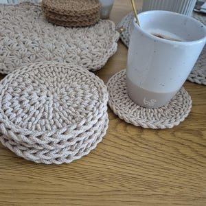 Crocheted coasters for cups and candles. Round placemats, round coasters, table decoration, coaster set made of cotton cord.