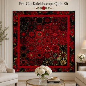 May include: A quilt featuring a Scarlet Poinsettia Pre-Cut Kaleidoscope Quilt Kit design. The quilt displays a repeating pattern of red poinsettia flowers and dark foliage arranged in a kaleidoscope style, framed by a solid red border.