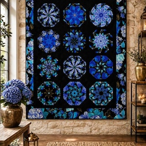 May include: A large, black quilt with a repeating pattern of blue floral designs. The quilt features nine octagonal shapes filled with intricate blue flower patterns. The border is adorned with blue floral accents, creating a striking contrast against the black background.