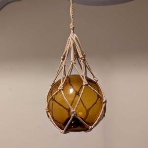 Vintage Hollow Amber Glass Ball in Macrame Twine Hanging Ornament Fishing Float