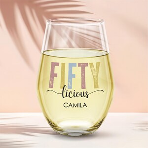 Celebrate a milestone with this 50th birthday custom stemless wine glass! Featuring the fun Fiftylicious wine cup design and custom name, it makes the perfect birthday gift for women. This personalized wine gift for friend is a thoughtful way to mark the occasion and is an ideal turning 50 gift for her or a unique 50th birthday keepsake.
