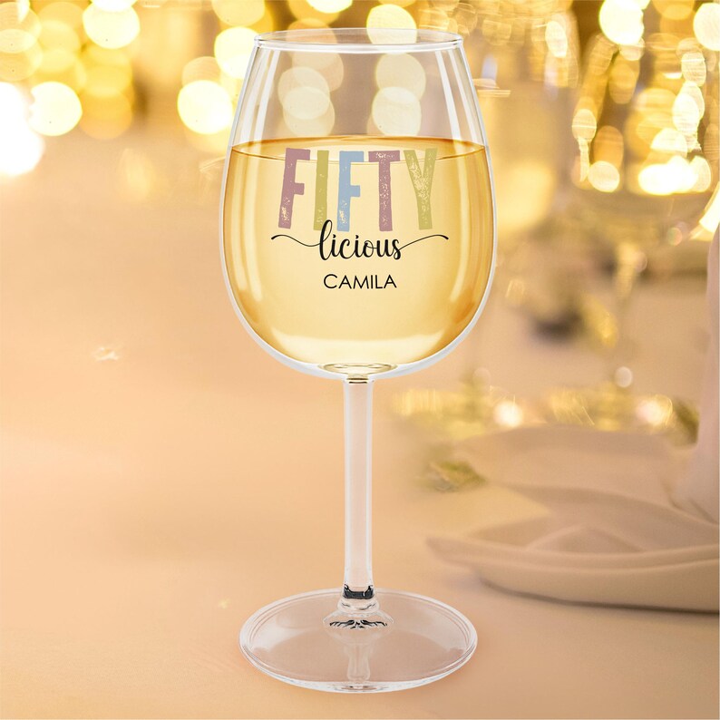 Celebrate a milestone with this 50th birthday custom wine glass with stem! Featuring the fun Fiftylicious wine cup design and custom name, it makes the perfect birthday gift for women. This personalized wine gift for friend is a thoughtful way to mark the occasion and is an ideal turning 50 gift for her or a unique 50th birthday keepsake.