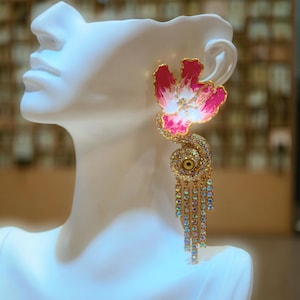 Elongated tassel design to enhance neckline elegance