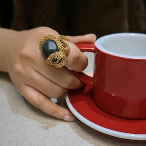 A bold collectible serpent ring with strong visual and symbolic presence.