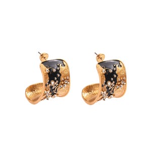 May include: A pair of gold-toned hoop earrings with a black enamel design and sparkling crystal accents. The earrings have a curved, open design and are set against a white background. The earrings are from Global Jewelry.